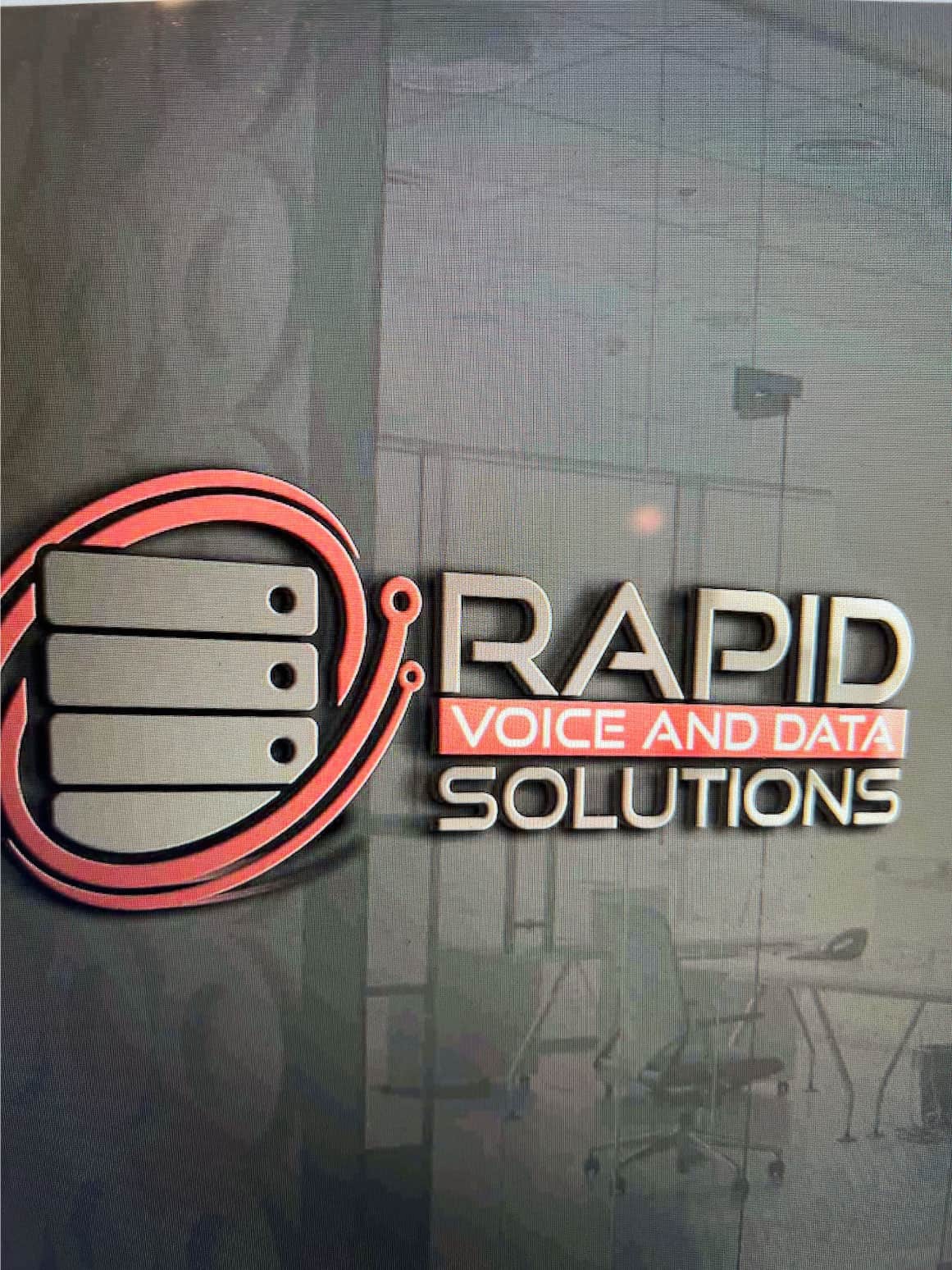 Rapid Voice and Data Solutions logo in company building.
